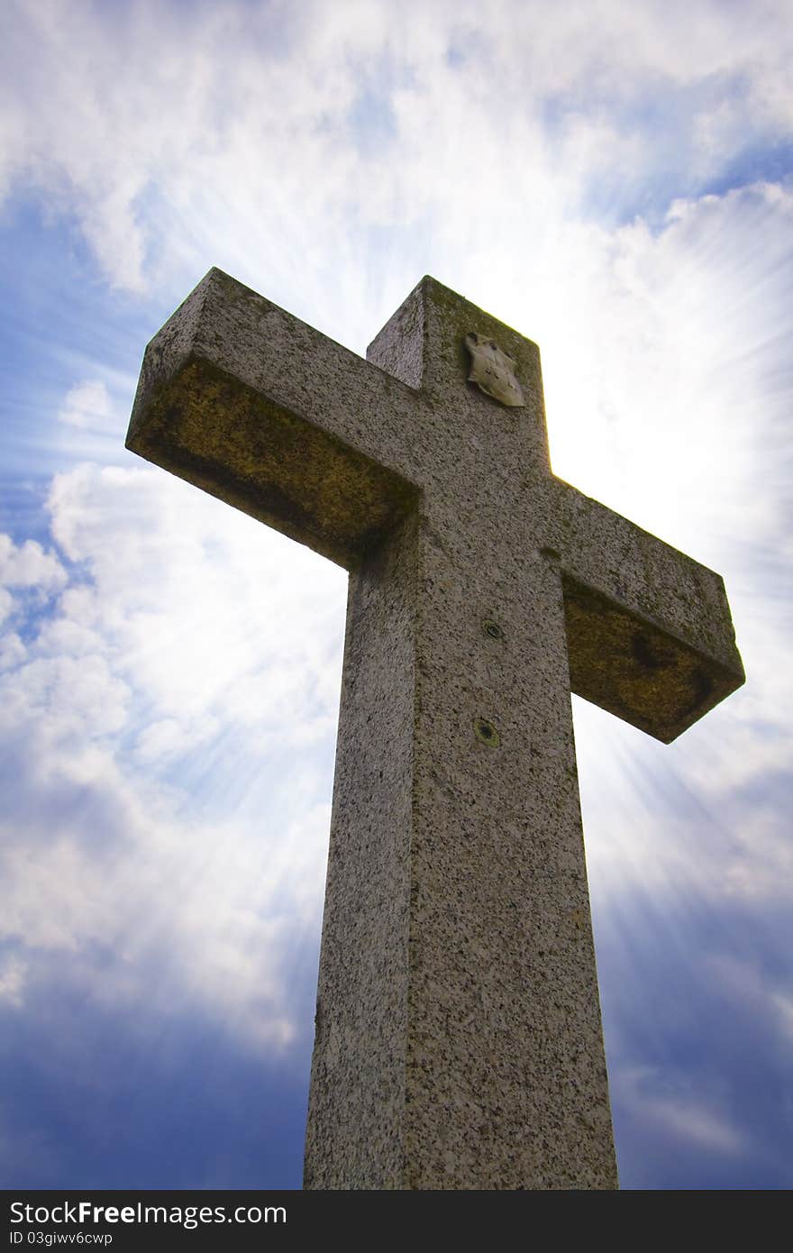 Cross with shine on blue sky background. Cross with shine on blue sky background