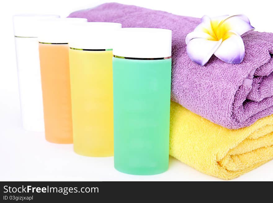 Towels, flower and cosmetics. Beauty spa concept. Towels, flower and cosmetics. Beauty spa concept