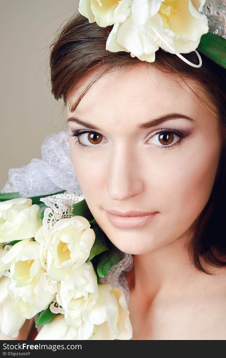 Beautiful young woman with flowers. Beautiful young woman with flowers