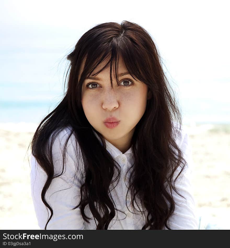 Girl lighten up at the beach in spring