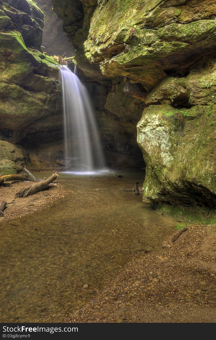 The spring rains bring waterfalls and fresh greens to  Conkle's Hollow in Hocking Hills Ohio. The spring rains bring waterfalls and fresh greens to  Conkle's Hollow in Hocking Hills Ohio.