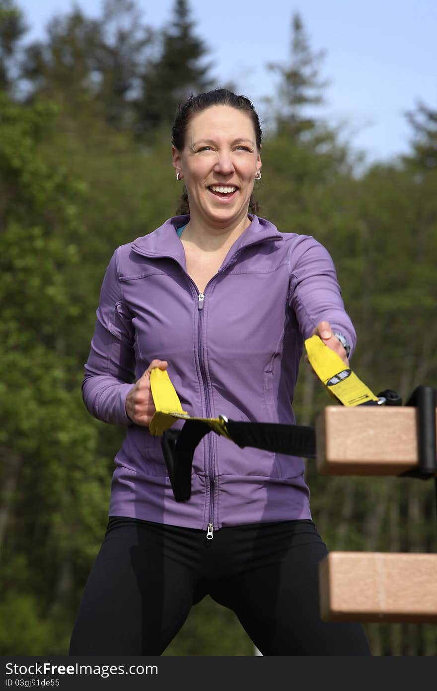 Women exercising with sports equipment outdoors. Women exercising with sports equipment outdoors