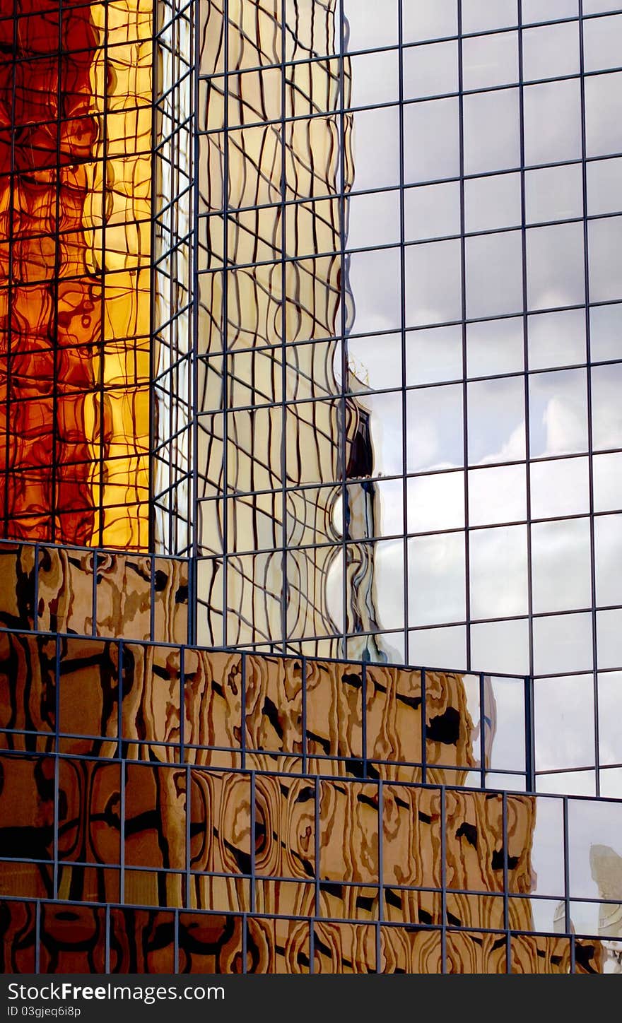 Gold tinted reflections, patterns in office tower glass. Gold tinted reflections, patterns in office tower glass.