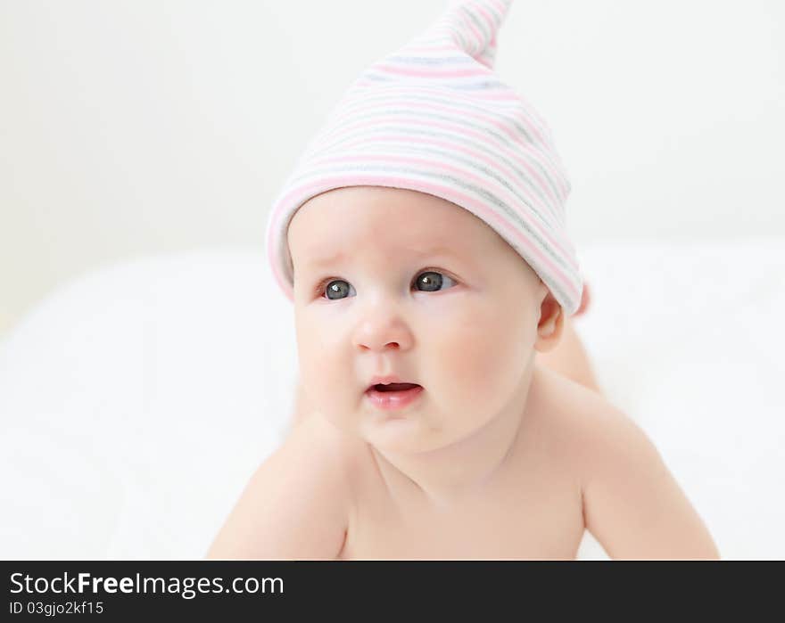 Portrait of a young child on a white background. Baby.