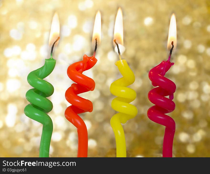 Four burning candles over shiny background. Four burning candles over shiny background