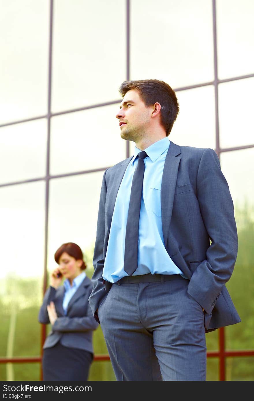 Businessman in front of building