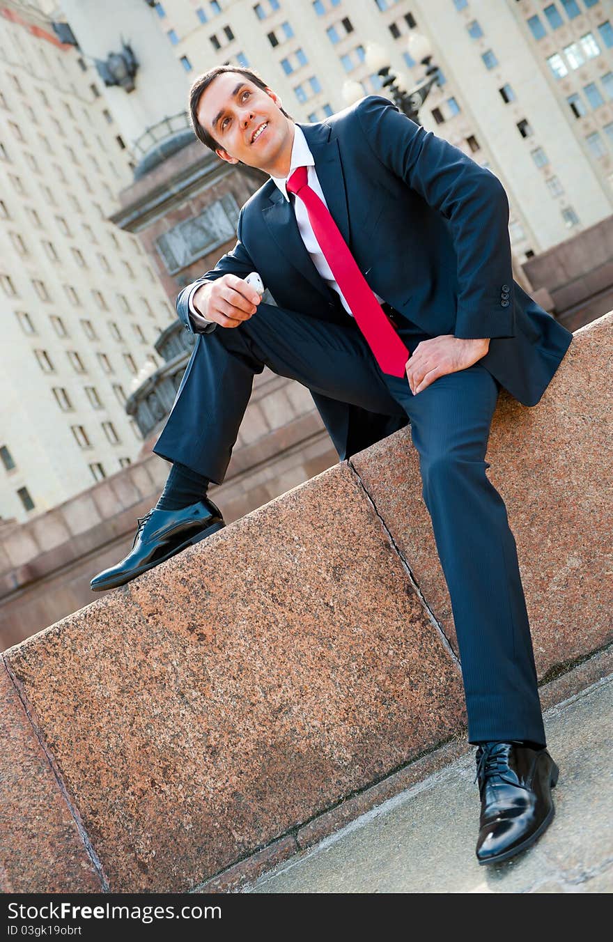 Young successful businessman portrait in modern downtown. Young successful businessman portrait in modern downtown