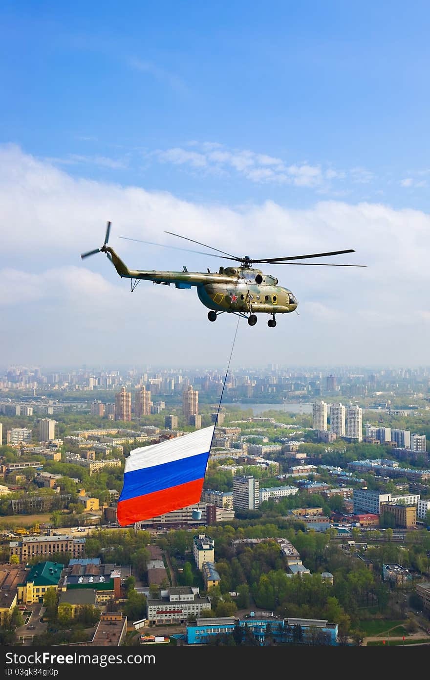 Helicopter with russian flag over Moscow at parade of victory day - aerial view