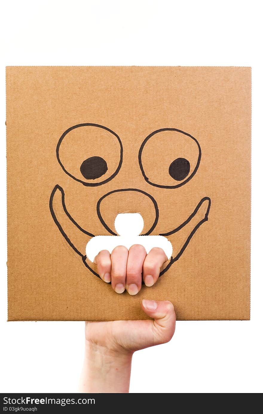 Cardboard With Sketch Of Smiling Face In Hand