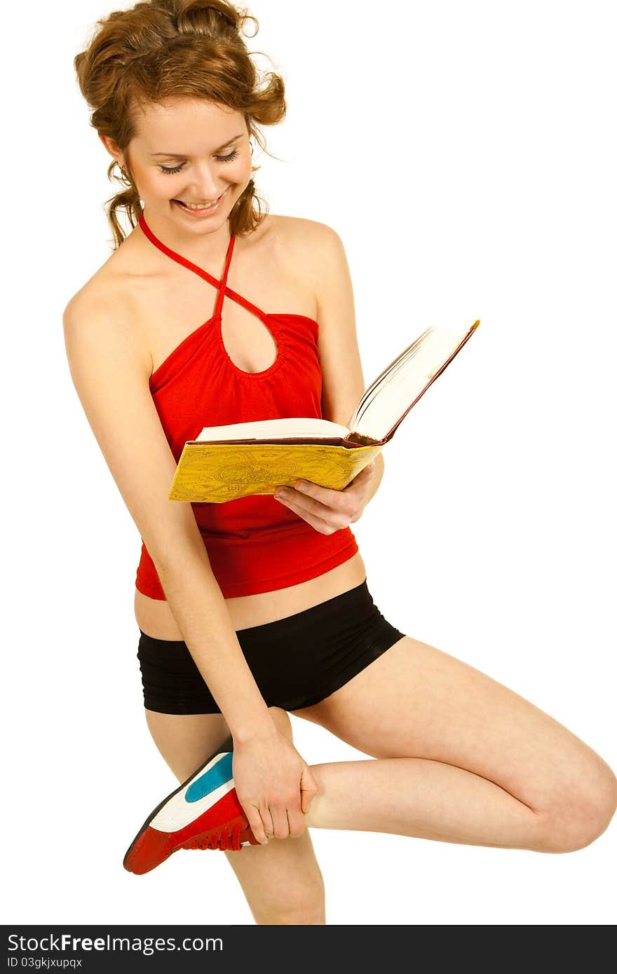 Young girl sportsman reading over white background