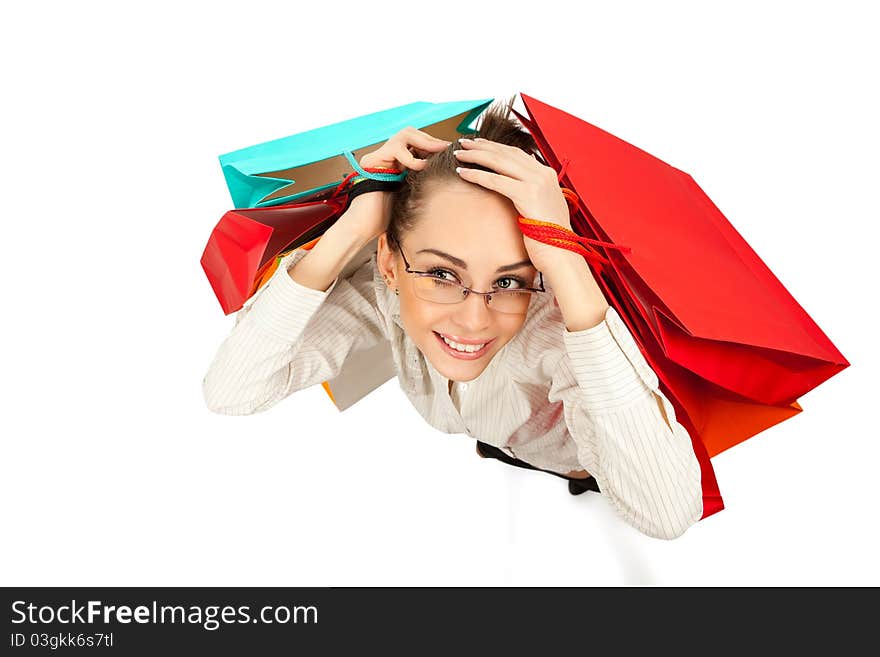 Top view of stylish woman swinging her arms  with shopping bags over white. Top view of stylish woman swinging her arms  with shopping bags over white