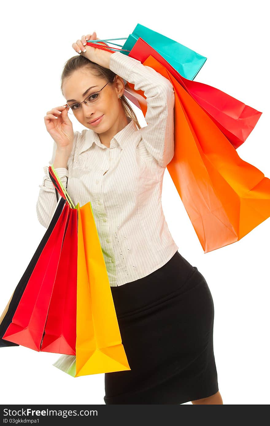 Businesswoman with shopping bags over white. Businesswoman with shopping bags over white