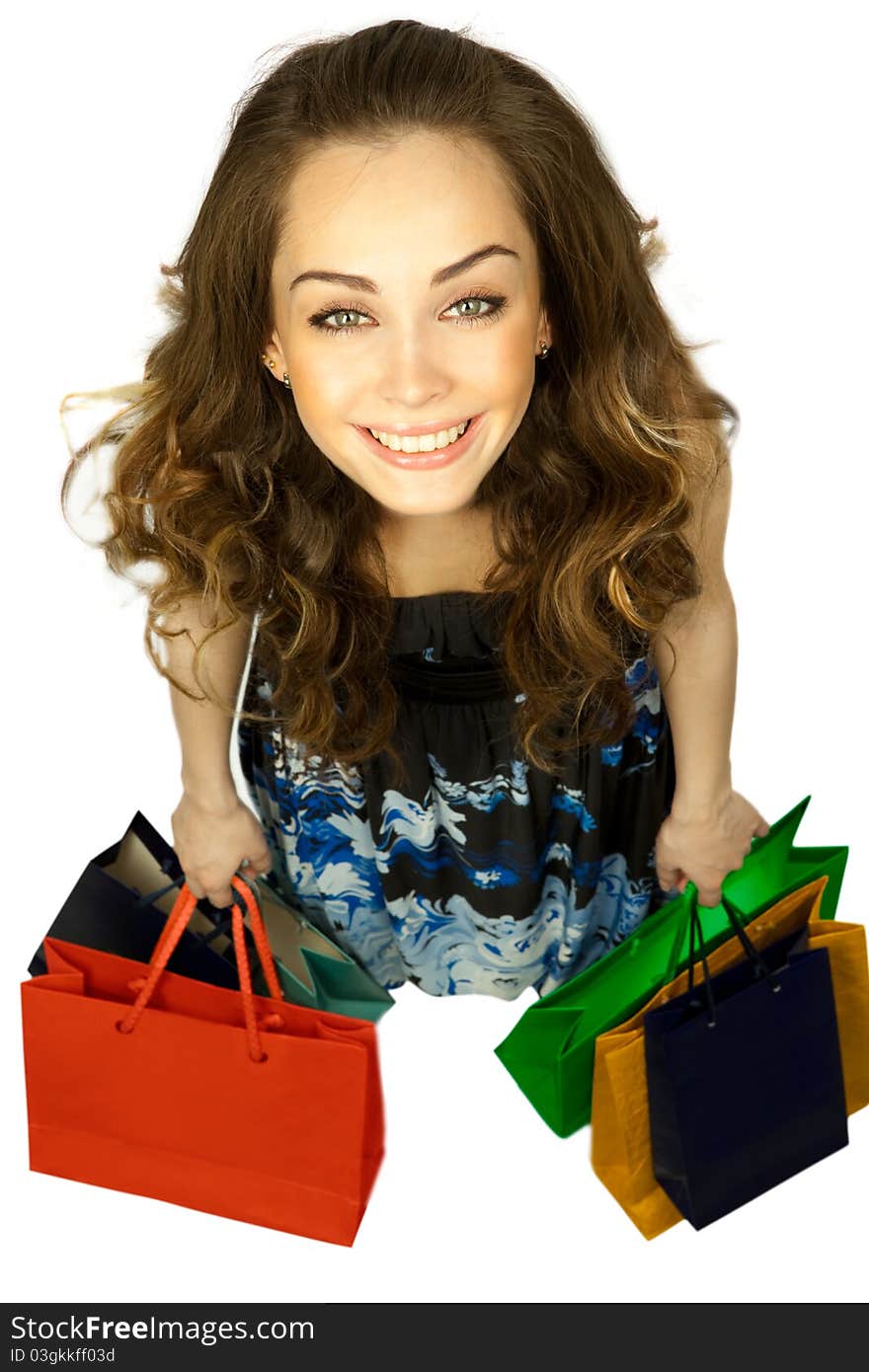 Top view of stylish woman swinging her arms  with shopping bags over white. Top view of stylish woman swinging her arms  with shopping bags over white