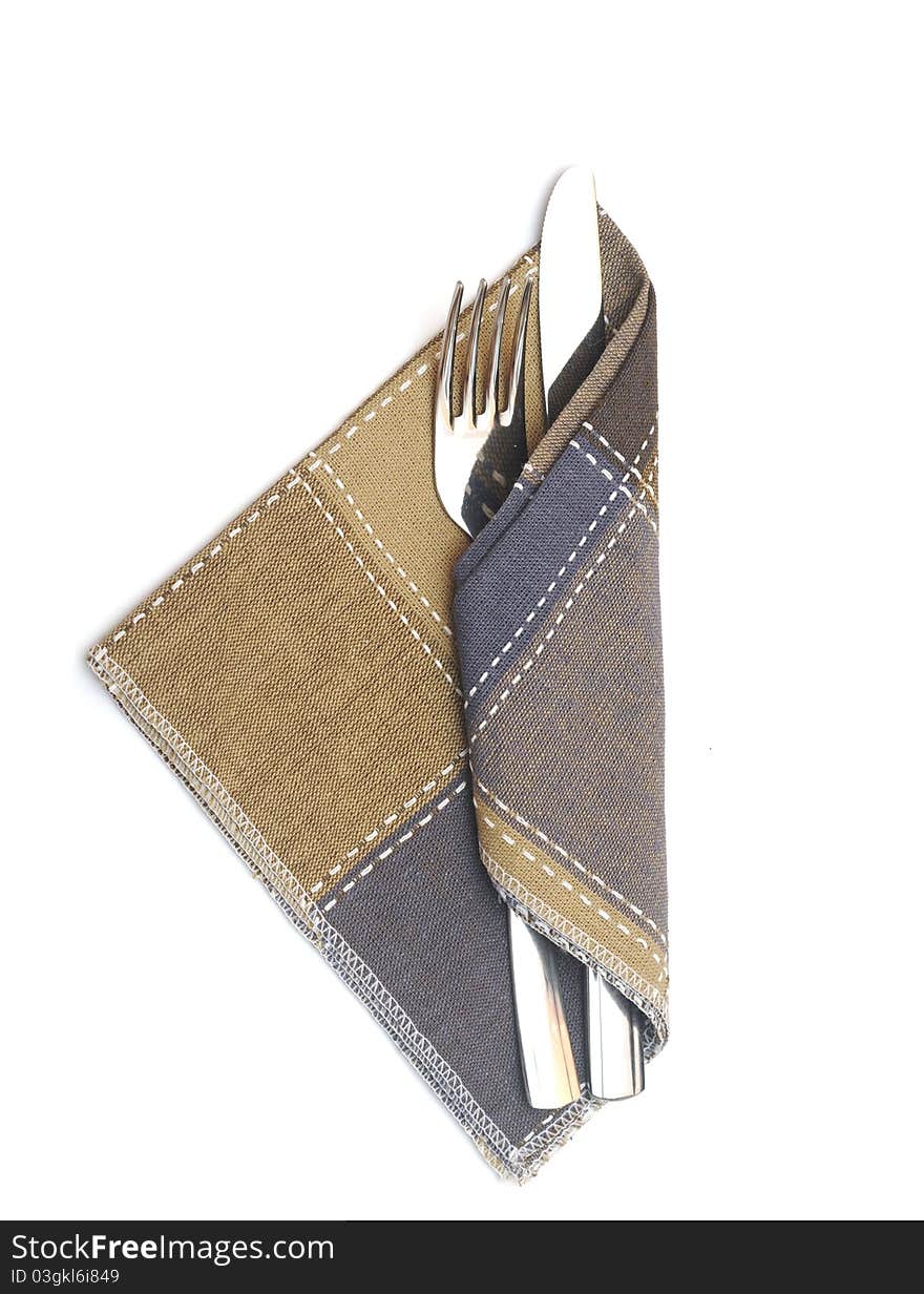 Knife and fork in a napkin