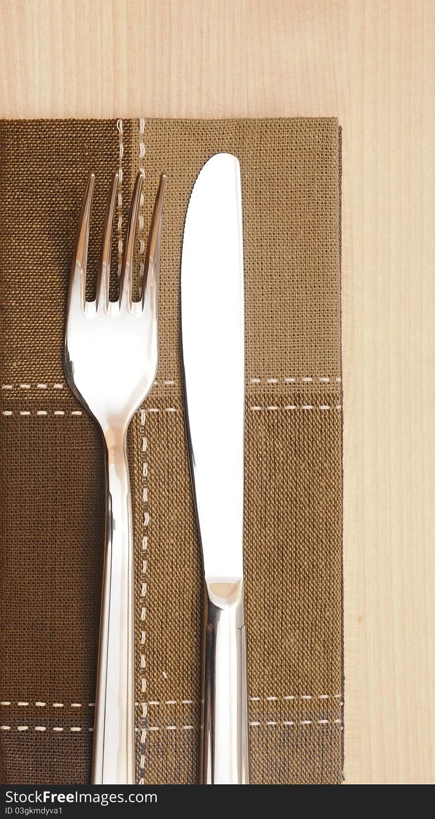 Knife and fork with napkin