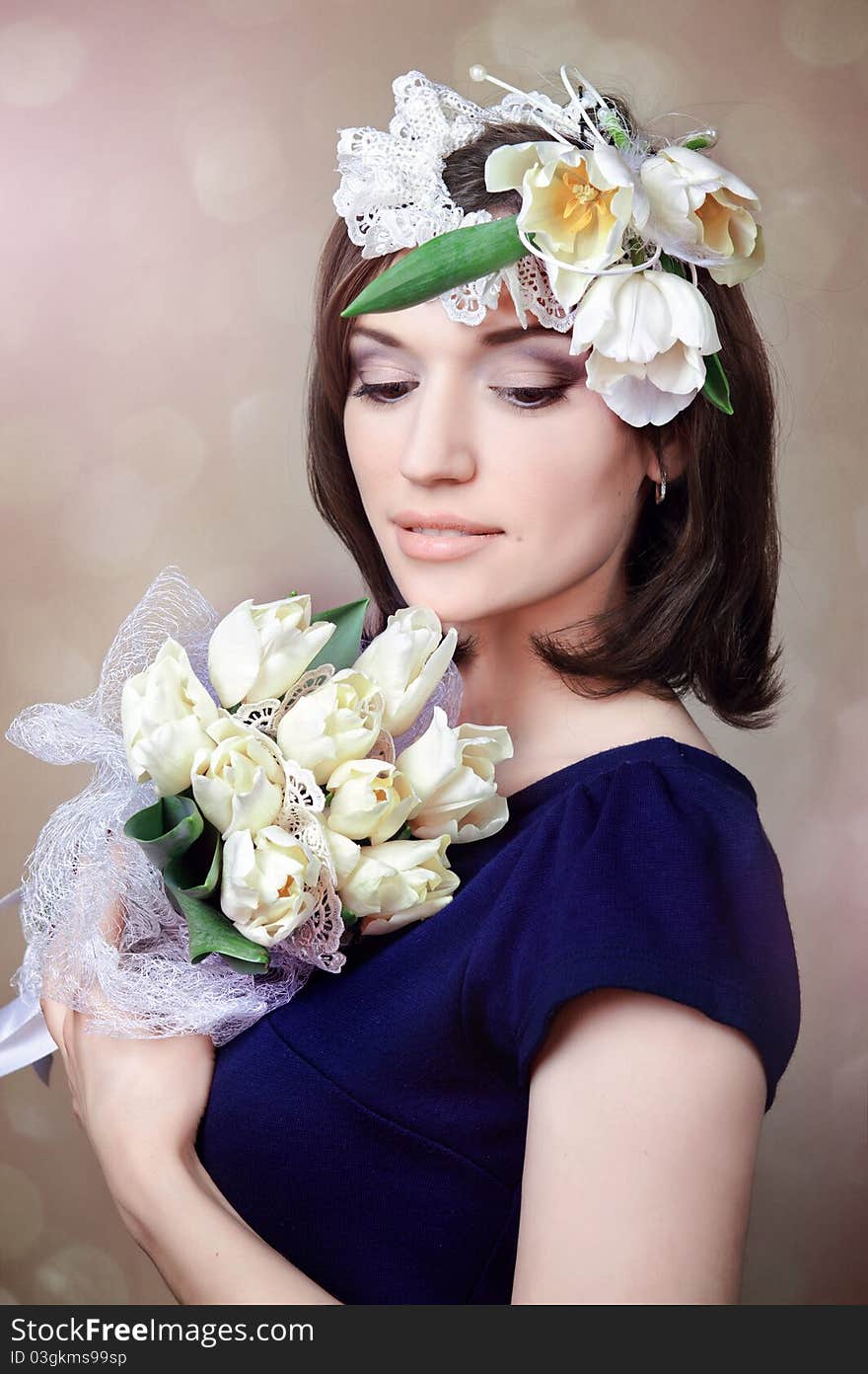 Beautiful young woman with white flowers in hair