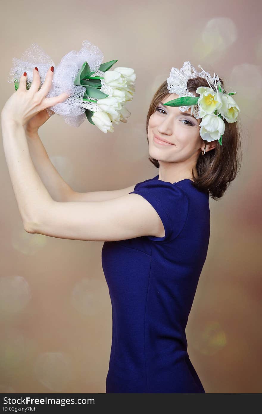 Beautiful young woman with white flowers