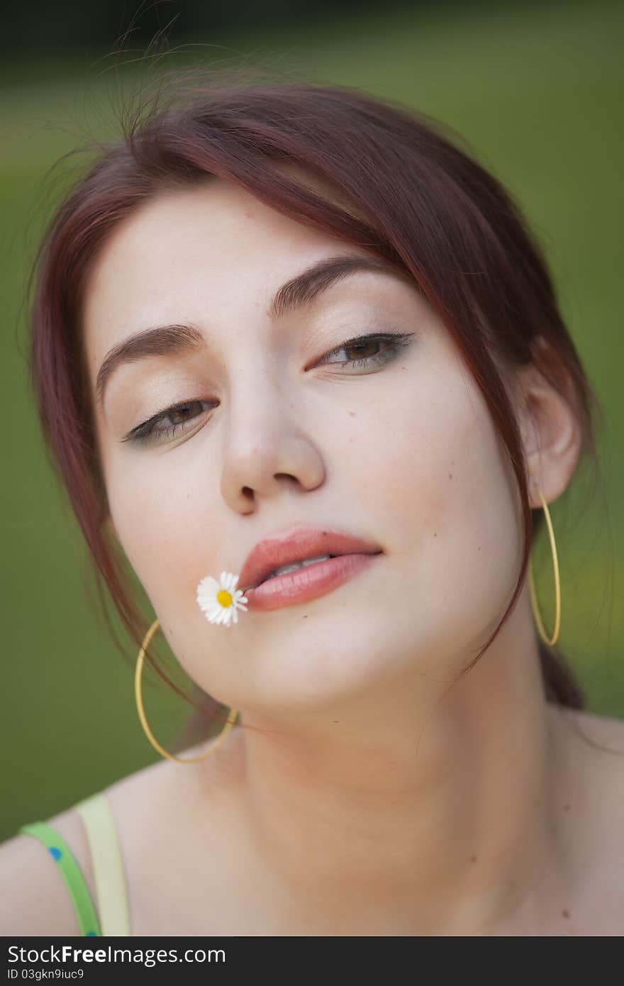 Portrait of young arrogant girl outdoors