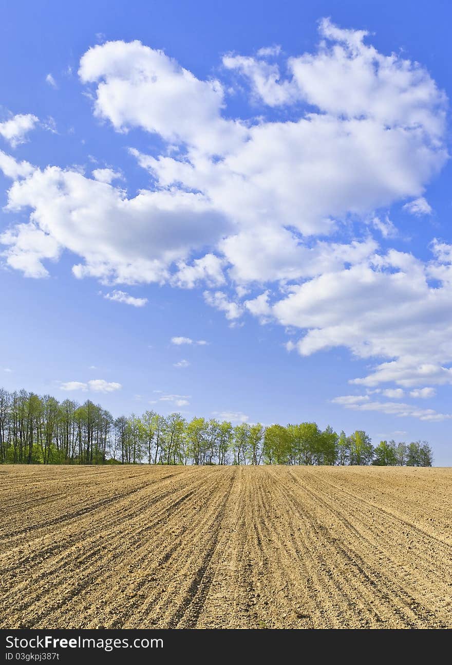 Cloudy figure hung over the hill opened for crops. Cloudy figure hung over the hill opened for crops