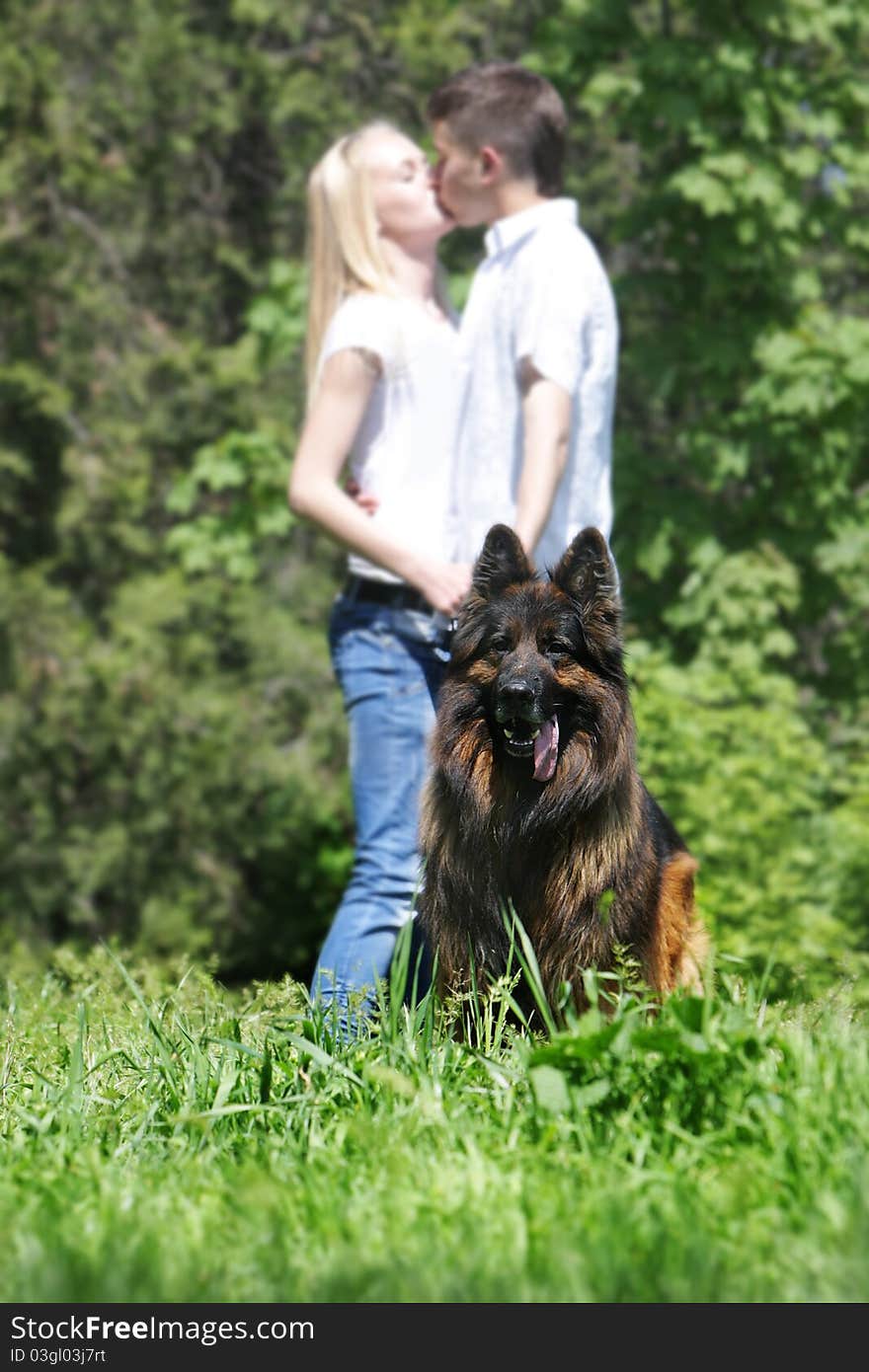 Couple with dog outdoors