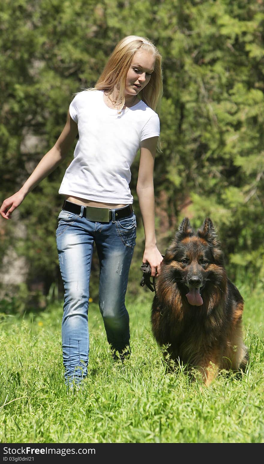 Young girl with dog outdoors