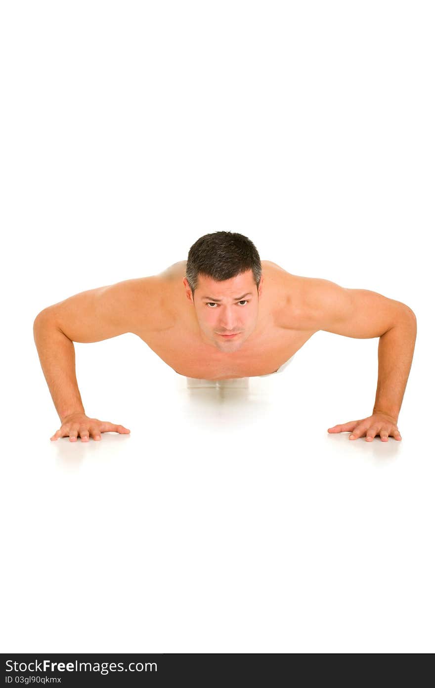 Man in white does push-ups in white background