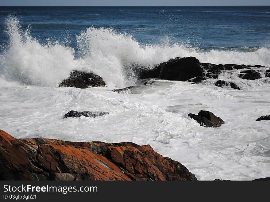 Waves crashing along the shore in Maine. Waves crashing along the shore in Maine