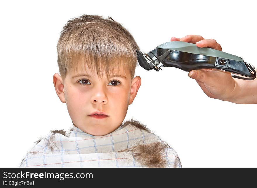 Boy mows clipper. Isolated on white background photo.