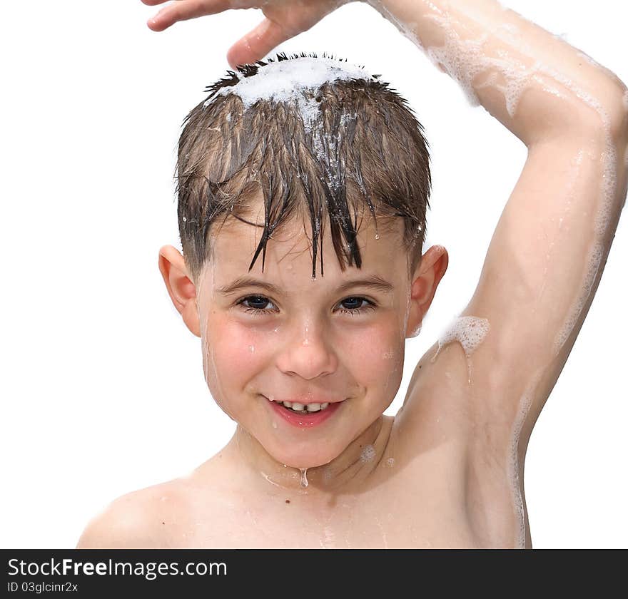 A boy swims in the bathtub. Isolated on white background picture