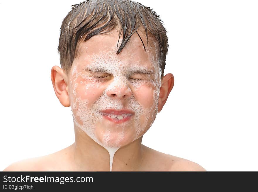 A boy swims in the bathtub. Isolated on white background picture