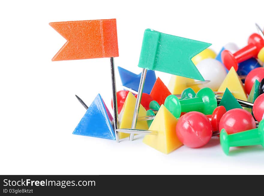 Closeup of multi-colored paper clips on white