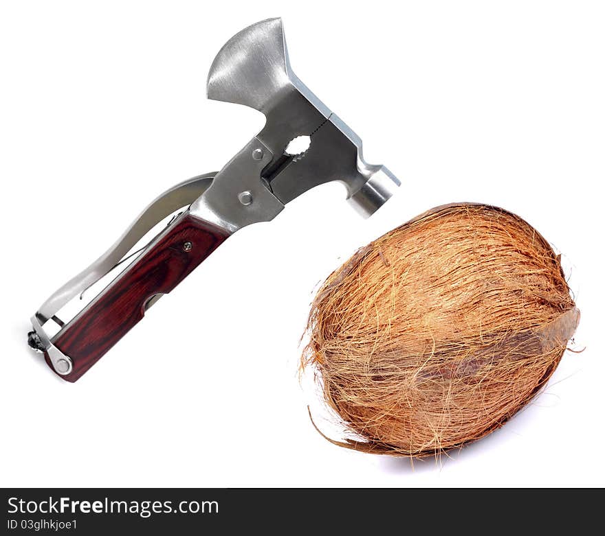 Breaking coconut with steel hammer isolated on white background.