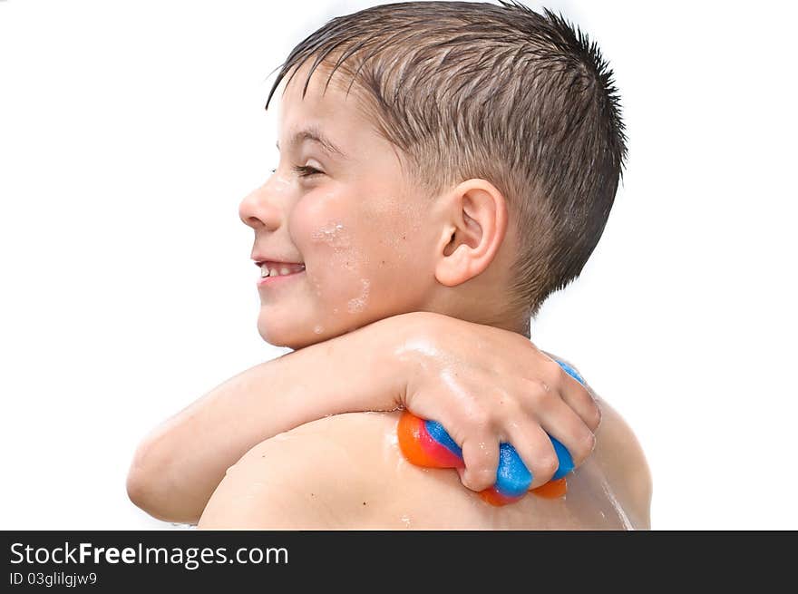 A boy swims in the bathtub. Isolated on white background picture