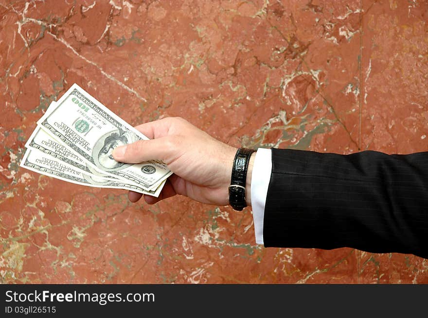 Businessman with dollars bills in the hand