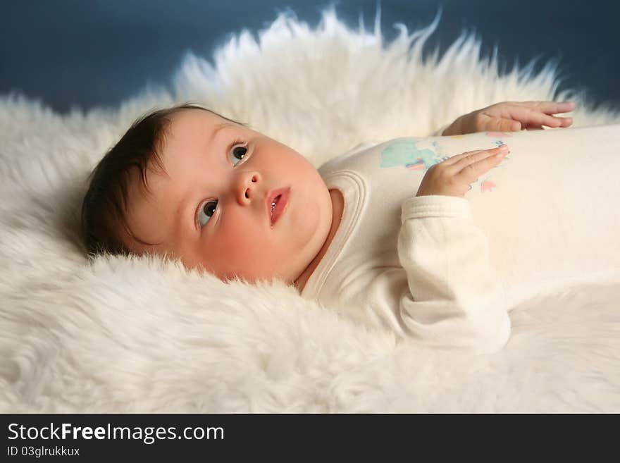 Sweet little baby on white fur. Sweet little baby on white fur