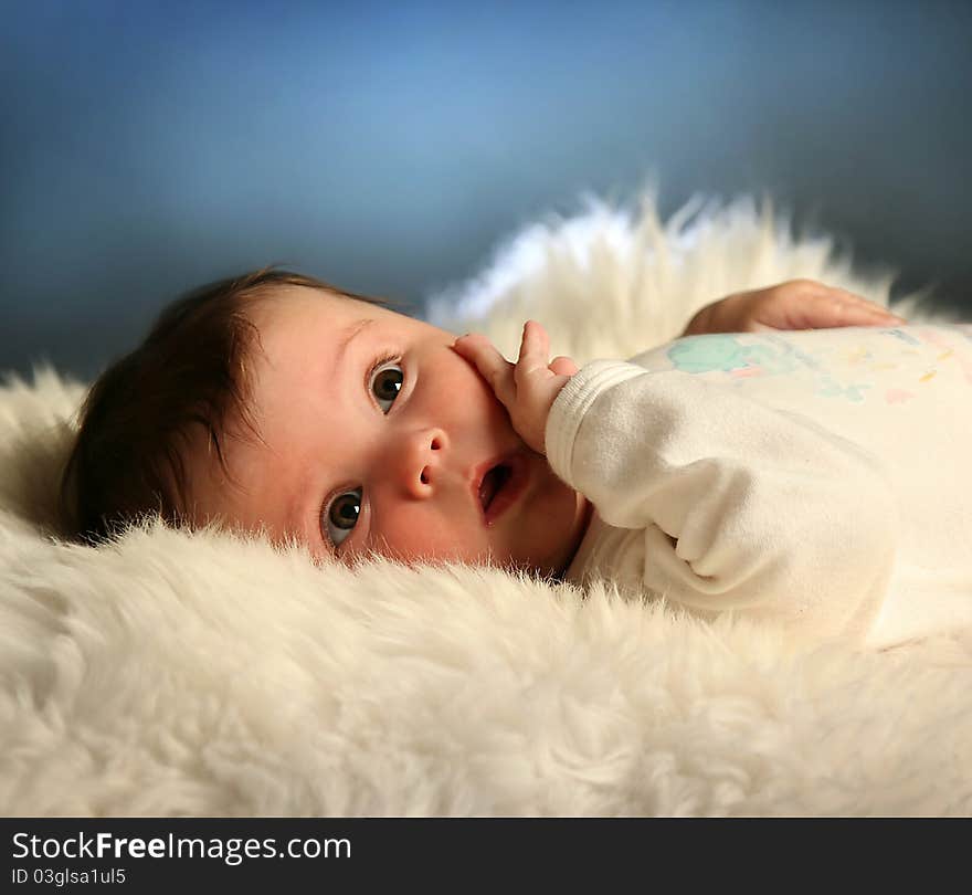 Sweet little baby on white fur. Sweet little baby on white fur