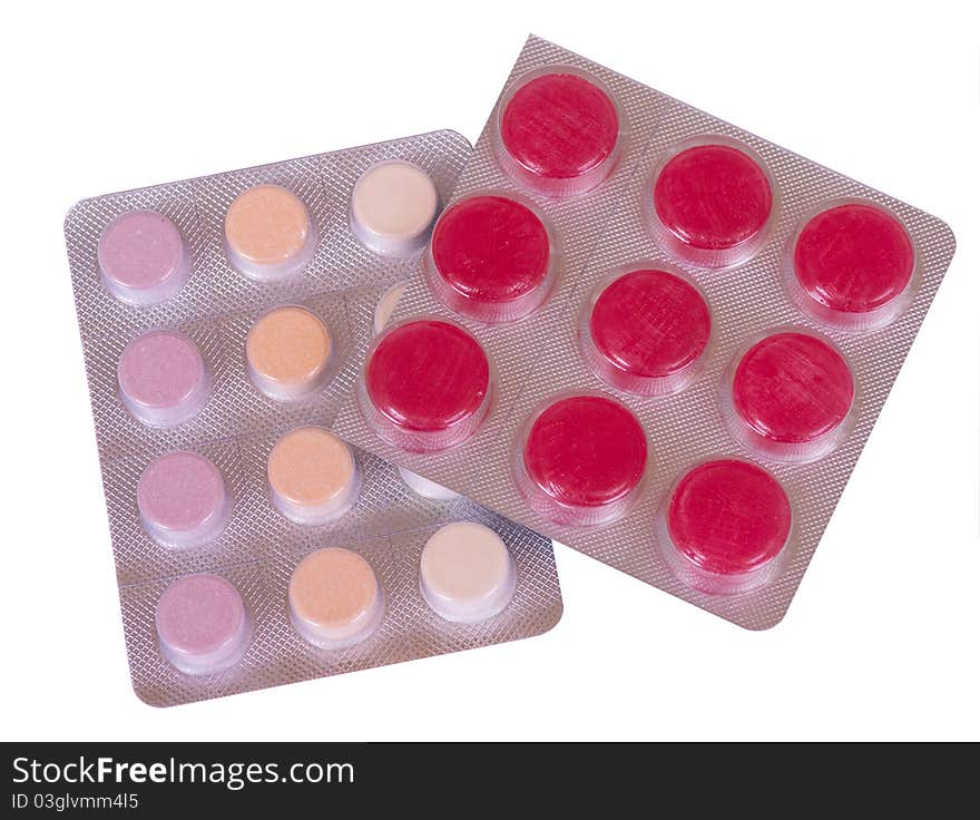 Image of a pills blister getting out form the box over white background. Image of a pills blister getting out form the box over white background.