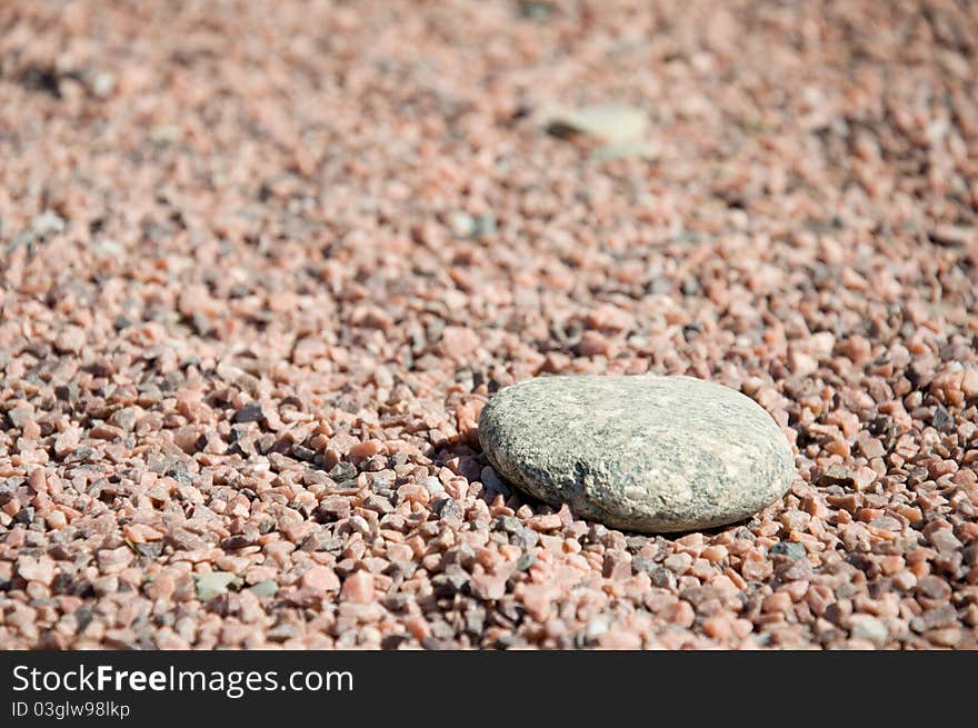 Macro of alone stone on gravel