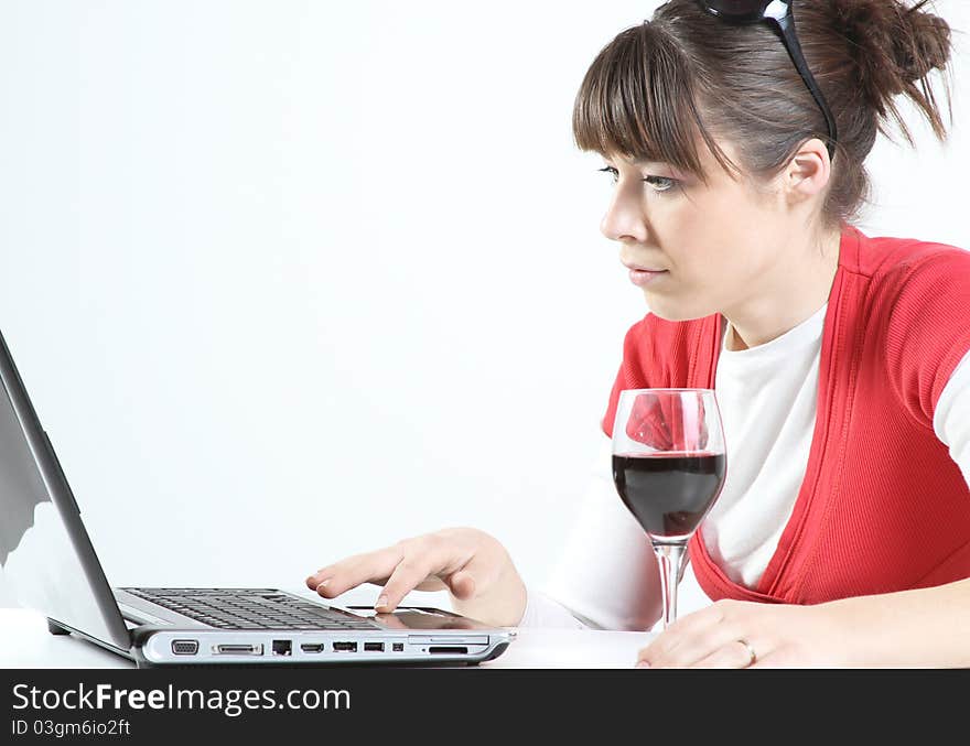 Young woman drink glass of wine at work. Young woman drink glass of wine at work