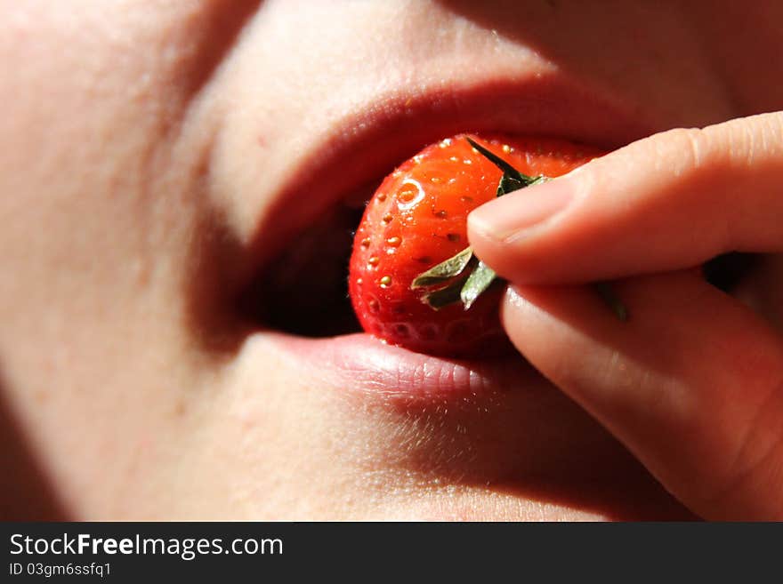 Womans mouth romantic eating freash strawberry. Womans mouth romantic eating freash strawberry