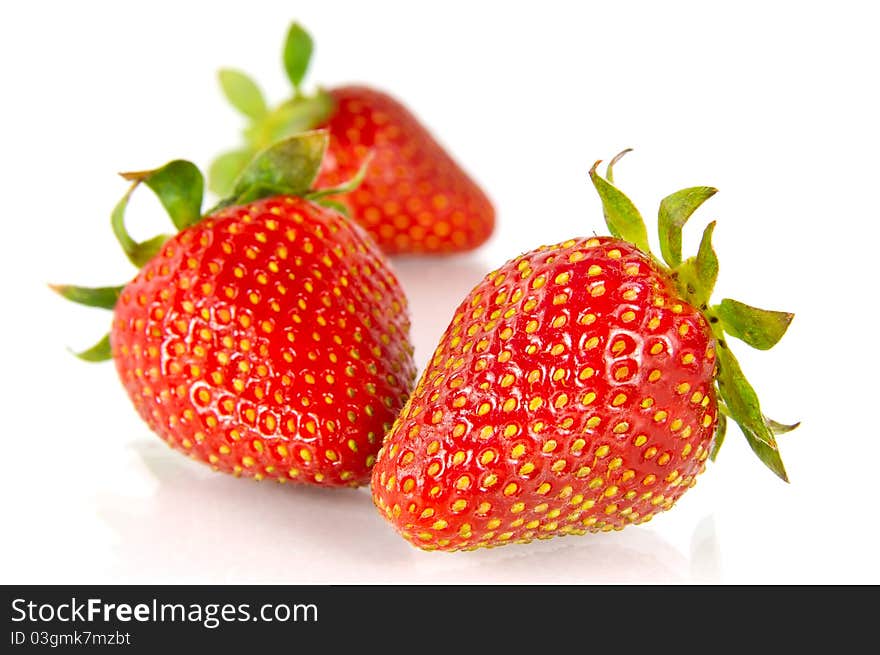 Three strawberries isolated on white background. Three strawberries isolated on white background