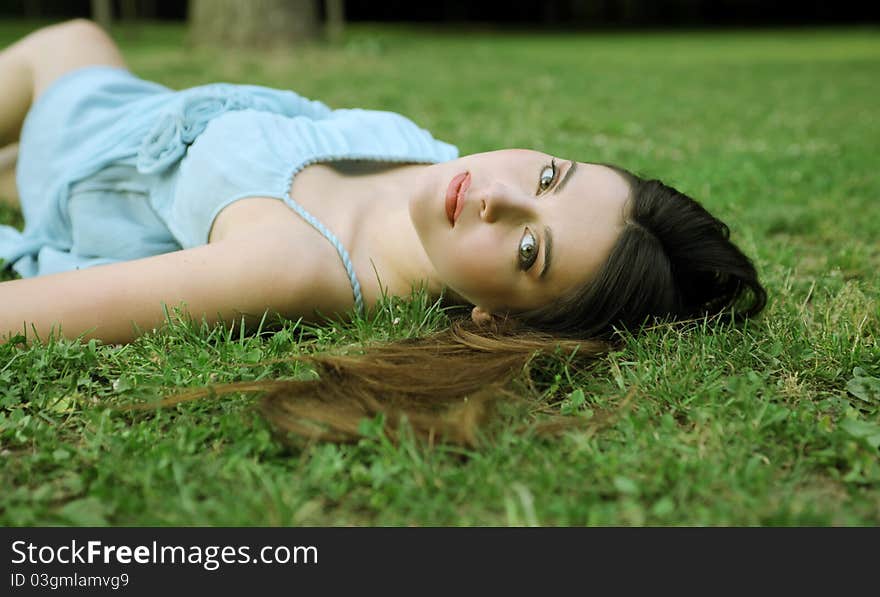 Beautiful woman lying on a green meadow. Beautiful woman lying on a green meadow