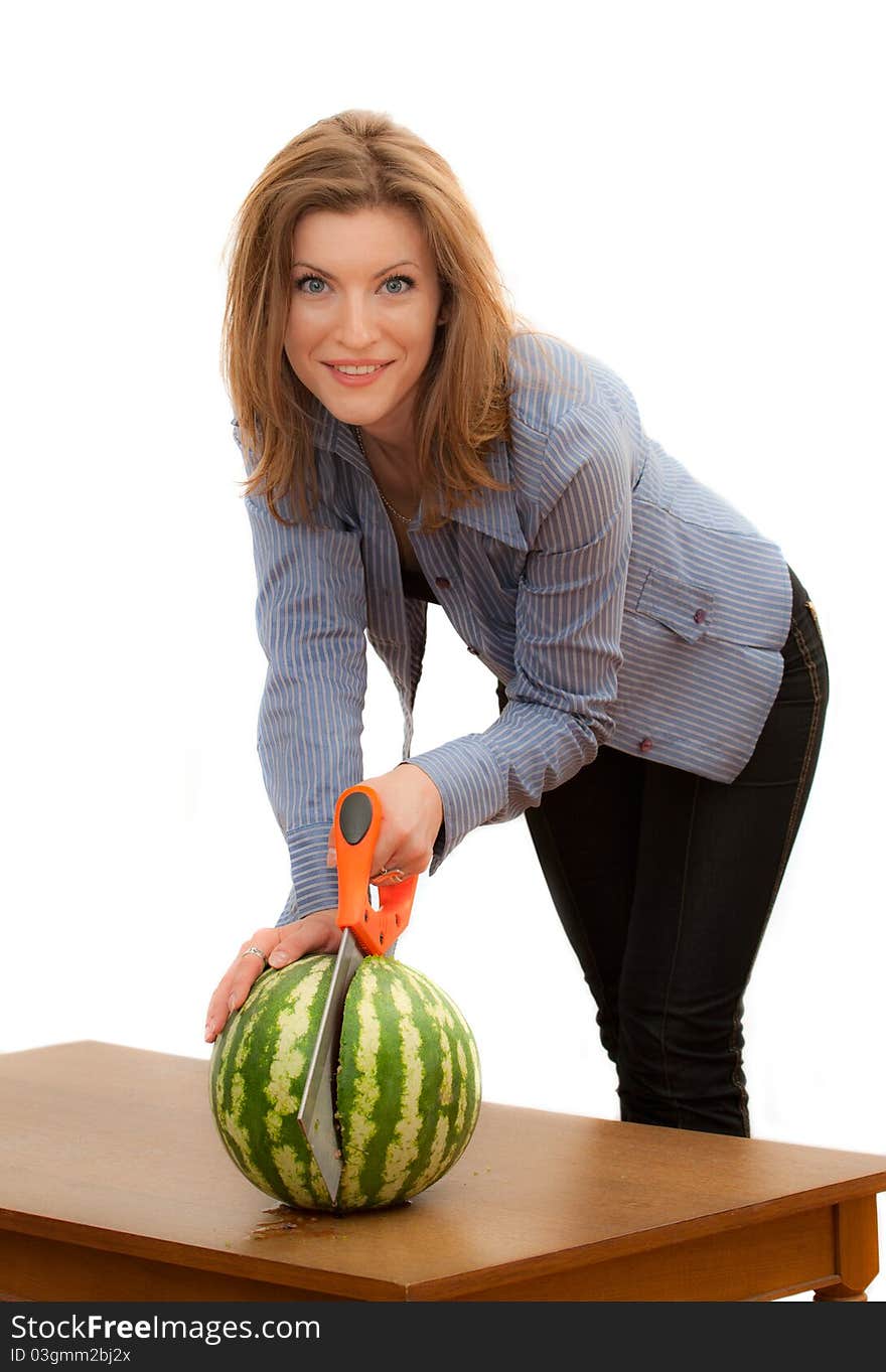 Beautiful young woman sawing the watermelon. Beautiful young woman sawing the watermelon