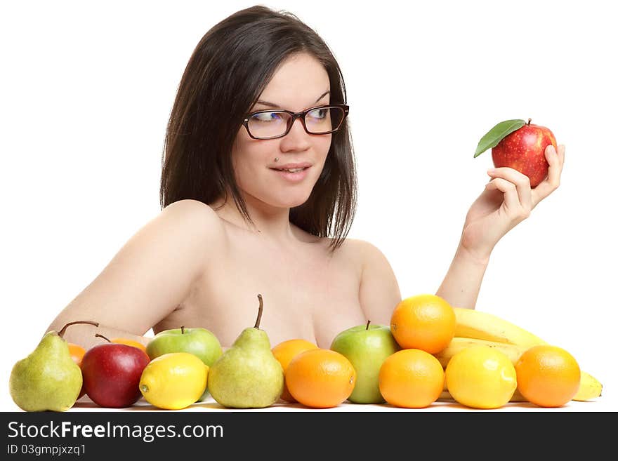 The beautiful girl wearing spectacles with an apple in a hand on a white background