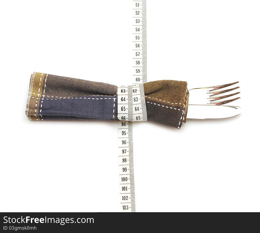 Knife and fork in textile napkin