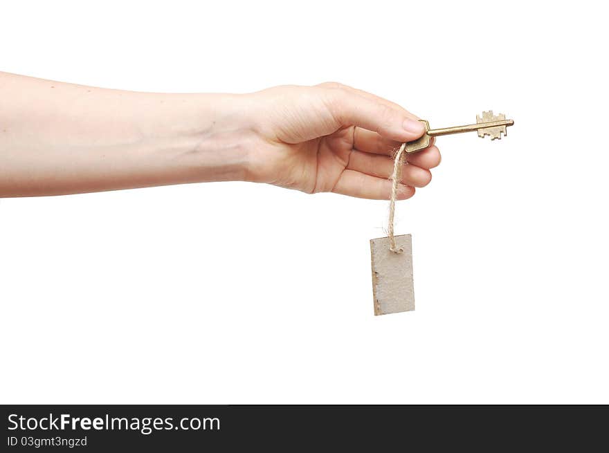 Hand and key with blank label isolated on white background