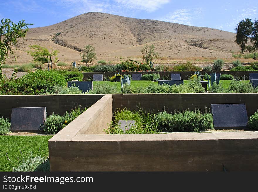 A cemetery in Riverside,CA with tombstones and a garden like setting. A cemetery in Riverside,CA with tombstones and a garden like setting.