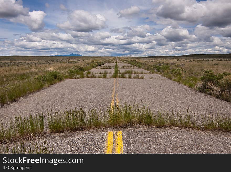 Unused, closed road leading to closed power plant in Idaho. Unused, closed road leading to closed power plant in Idaho