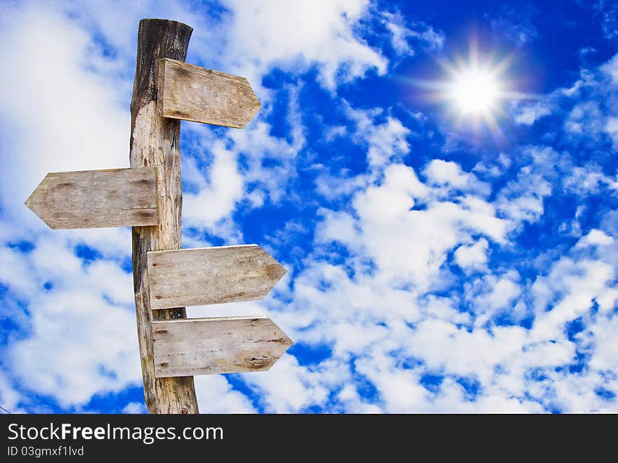 Wooden signboard on beautiful blue sky background. Wooden signboard on beautiful blue sky background