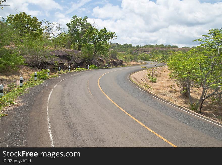 Road Beside Mountain And Blue Sky